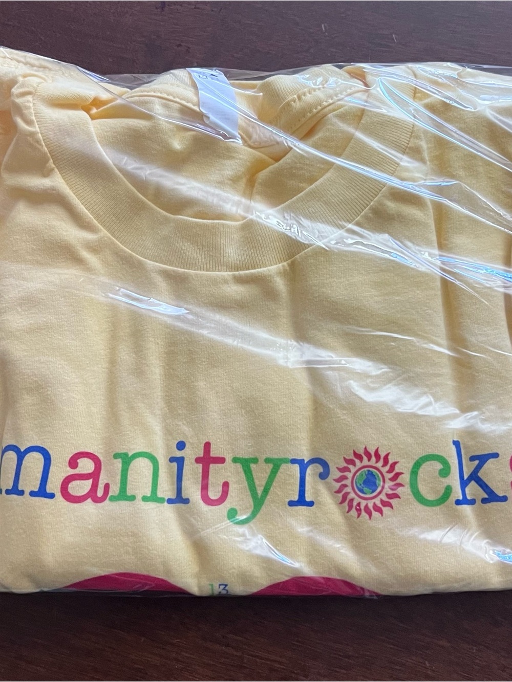 NEW Next Level Apparel Yellow Tee with Multicolor "humanityrocks" Graphic - Med